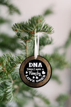 Load image into Gallery viewer, DNA Does Not Make a Family Love Does Christmas Ornament - Get 30% OFF + FREE Shipping When You Order 10 Or More.