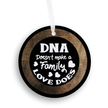 Load image into Gallery viewer, DNA Does Not Make a Family Love Does Christmas Ornament - Get 30% OFF + FREE Shipping When You Order 10 Or More.